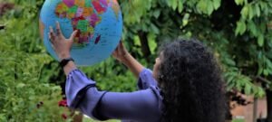 woman looking at a globe